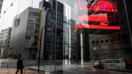 Japan's Nikkei index slides from a 34-year high after a sell-off on Wall Street