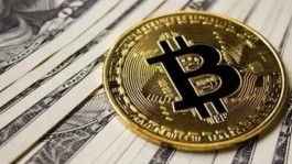 بيتكوين يتراجع دون 80,000 دولار وسط مخاوف أسعار الفائدة