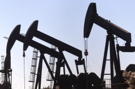 Oil prices hold gains amid signs of falling US inventories