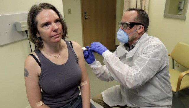 A volunteer receives the first vaccine against the Coronavirus