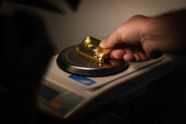 Gold touches new record high, heads for fourth weekly gain