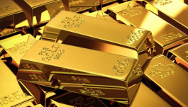 Gold stabilizes as the dollar rises amid expectations of an interest rate hike