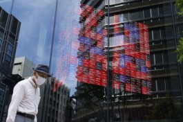 Japan shares hit record high on chip boost